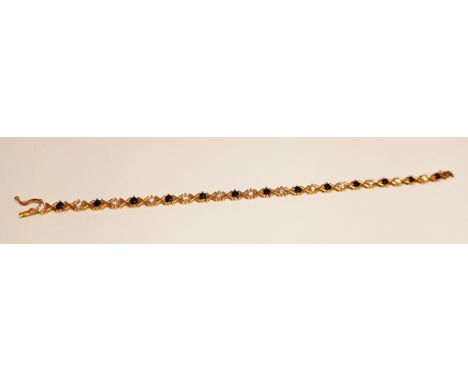 9CT GOLD SAPPHIRES AND WHITE STONES BRACELET 19CM LONG 7g
THIS ITEM IS IN SECURE OFF-SITE STORAGE, VIEWING BY APPOINTMENT ONL