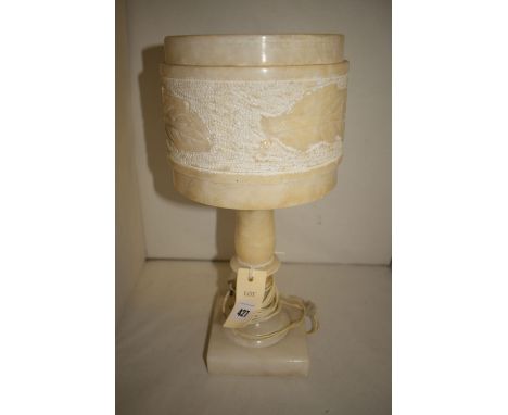An early 20th Century alabaster table lamp, carved leaf decoration to body.