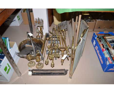 A quantity of brassware, to include: two sets of fire irons; together with two pairs of cast dogs; a jam pan; a folding fireg