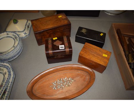 A Georgian walnut tea caddy; three other wooden boxes, one ebonised; and an inlaid walnut tray.  (5)