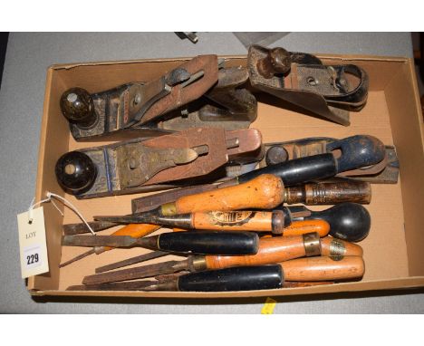 Woodworking tools, to include: a Stanley plane; three others; together with chisels.