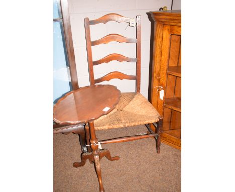 A ladder back chair with rushwork seat; together with an occasional table.