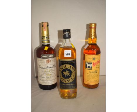 A bottle of White Hall Blended Scotch Whisky; a bottle of Canadian Club Whisky, with duty free label inscribed '1970'; and a 