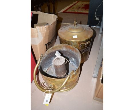A reproduction brass coal scuttle and brass lidded coal bin; and a Vintage miner's lamp.