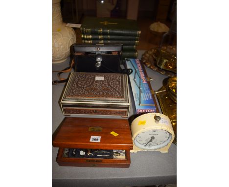 An early 20th Century Smith's kitchen timing clock; drawing instruments; stencils; etc., a carved box with inlaid decoration;