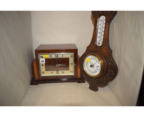 An Art Deco style mantel clock, in mahogany case with rectangular arabic dial; together with an aneroid barometer in carved a