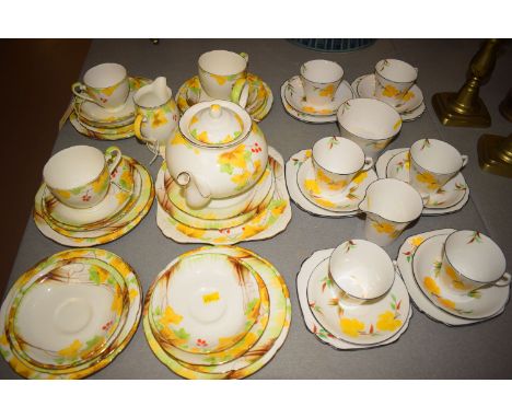 An early 20th Century Royal Grafton ceramic part breakfast service, with hand-painted berry and leaf decoration, on white gro