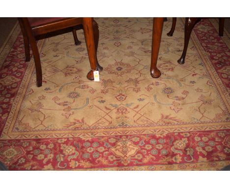 An Imperial machine-made carpet decorated with foliate scrolls.