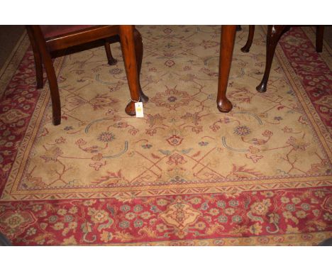 An Imperial machine-made carpet decorated with foliate scrolls.