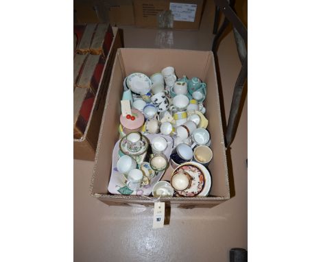 A box containing coffee cans and saucers, by Masons Ironstone; Royal Worcester 'English Garden'; Wedgwood 'Tapestry'; Copelan