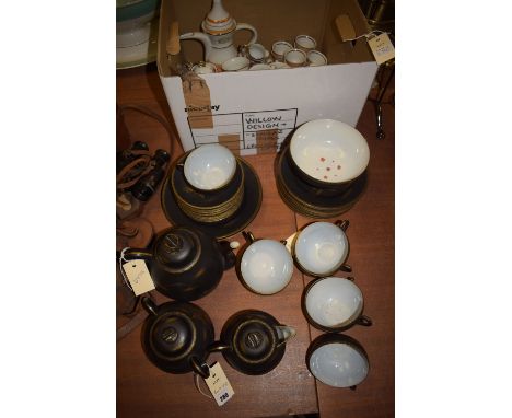 A Japanese tea set in black and gilt decoration, comprising: teapot, cream, sugar, tea cups, saucers and side plates; togethe