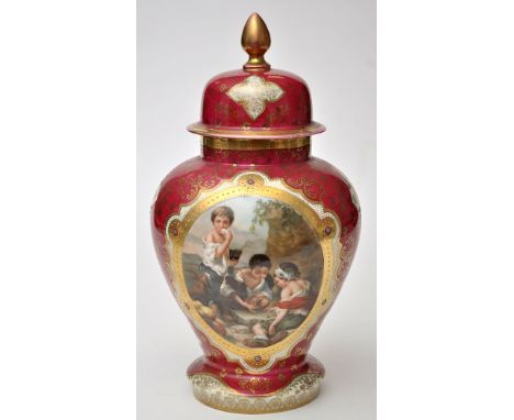 A German red ground inverted baluster vase and cover, with reserve panel decorated with scene of children playing dice, heigh