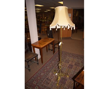 A late 19th Century brass extending standard lamp (converted from an oil lamp).
