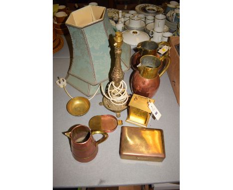 Three copper and brass jugs, various; a brass cigarette box; a brass table lamp; carriage clock; two lamp shades; etc.