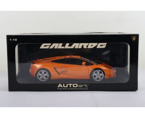 Autoart Performance Lamborghini Gallardo, 1:18 Scale, metallic orange diecast body, in mint pre owned condition, has been on 