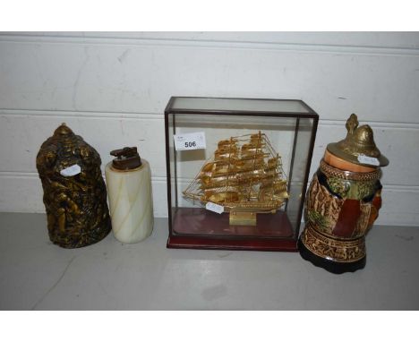 MIXED LOT: A METAL MODEL OF A TALL SHIP SET IN GLASS CASE, A BEER STEIN, TABLE LIGHTER AND A NOVELTY CANDLE (4)