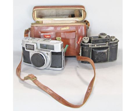 A Minolta Rokkor Automatic camera and a further Certo Dollina vintage camera in leather case 