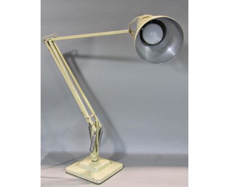 A Herbert Terry anglepoise lamp on a square two tier base in cream 