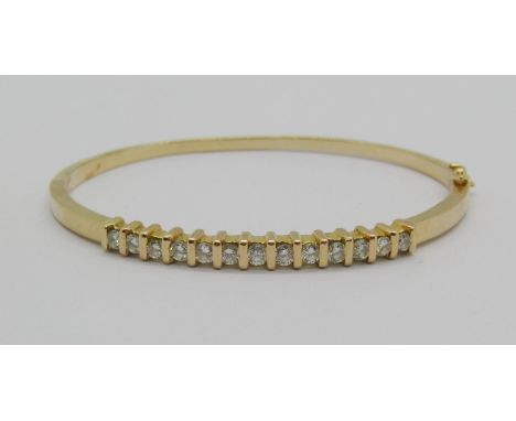 18k hinged bangle set with thirteen diamonds, 0.65ct total approx, 12.5g 