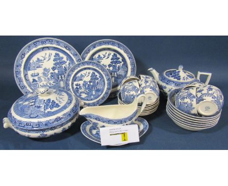 A collection of Willow pattern china wares by Wedgwood comprising teapot, seven cups, six saucers, milk jug, eight side plate