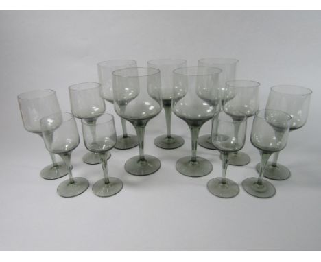 A collection of Orrefors Rhapsody Smoky grey wine glasses, eleven small wines, 17cm tall, five clarets, 15cm tall, four sherr