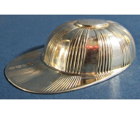 A early 20th century silver jockey cap caddy spoon, Birmingham 1911, maker Alfred Marston 