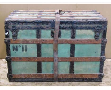 A wooden lathe and steel banded trunk with hinged lid and stitched leather carrying handles, label to interior A Boswell, Por