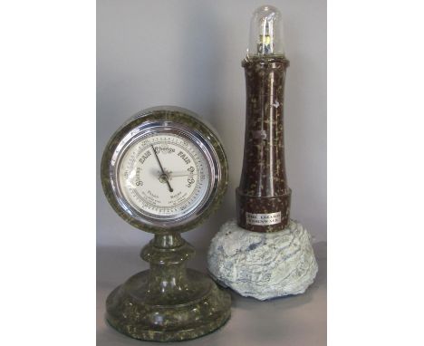 A Serpentine stone framed aneroid barometer and a further Serpentine stone table lamp in the form of a lighthouse 