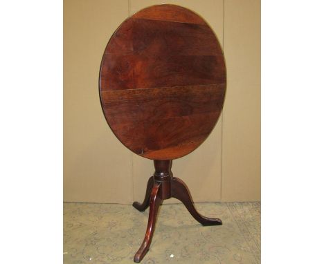 A Georgian style mahogany circular snap top occasional table, raise on a pillar tripod base, 72cm diameter 