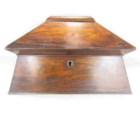 A large Regency rosewood sarcophagus tea caddy, with a well fitted interior mixing bowl (not original) with wooden ring handl