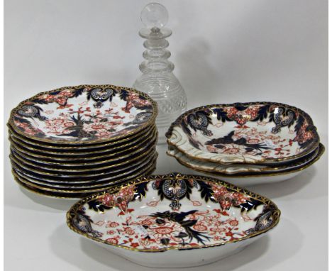 A collection of Derby table ware with Imari pattern detail, eleven plates and four shaped dishes together with a Georgian rin