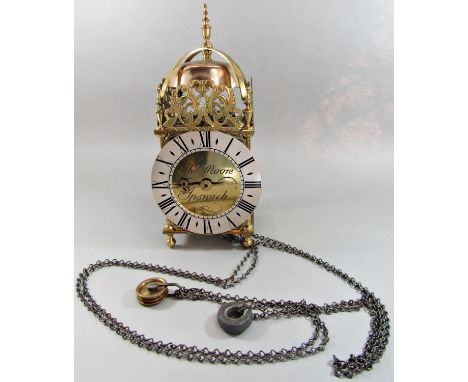 A traditional old English style lantern clock with brass case, silvered dial and timber wall bracket engraved Thomas Moore of