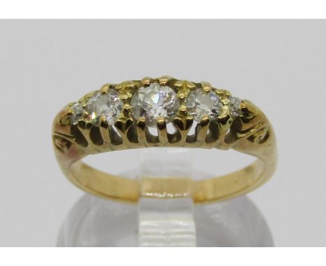 Yellow metal graduated five stone diamond ring, centre stone 0.20ct approx, size K/L, 4.3g 