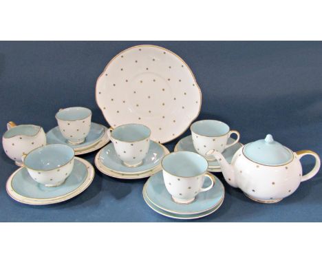 A Susie Cooper tea set with pale blue, white and gilt star decoration comprising teapot, cake plate, milk jug, four tea cups 