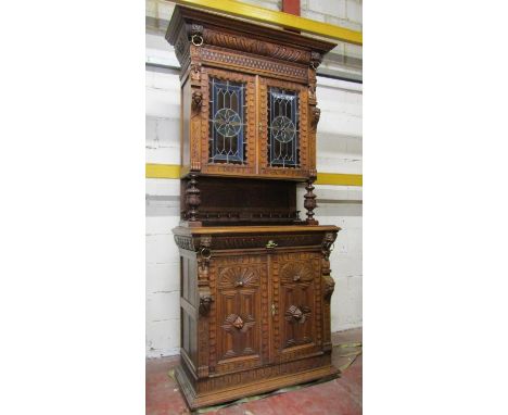 A 19th century oak pier cabinet, the lower section enclosed by a pair of quarter panelled doors, open centre, the upper secti