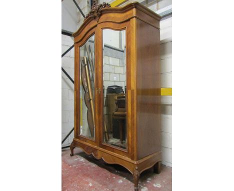 A 19th century hanging robe, the front elevation enclosed by two shaped bevelled edge mirror plate doors within chevron bande