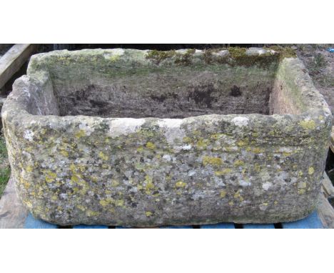 A weathered rectangular natural stone trough with rounded front corners, single notch/channel 102 cm wide x 61 cm deep x 38 c