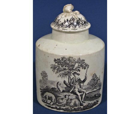 An 18th century cylindrical cream ware tea caddy and cover with pastoral landscapes 