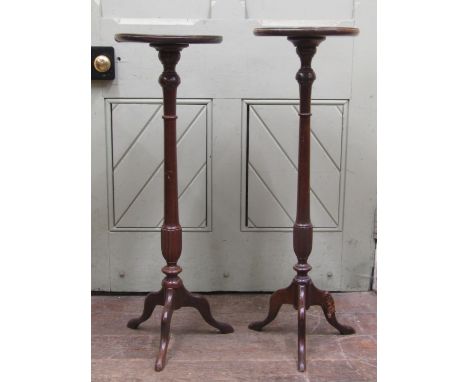 A pair of reproduction Georgian style mahogany torcheres on tripod bases, 90cm high