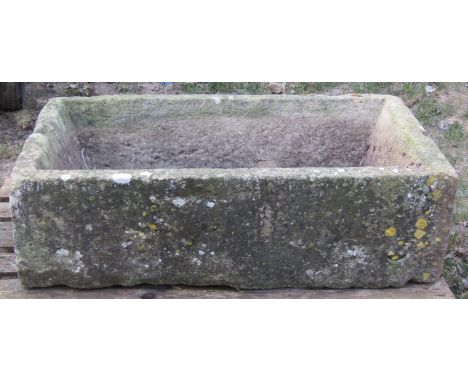 A weathered rectangular natural stone trough with canted interior 102 cm long x 62 cm wide x 30 cm high 