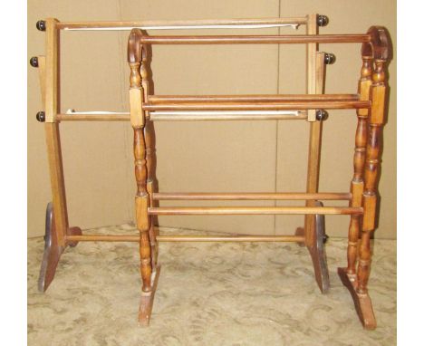 A floorstanding rail raised on turned and swept supports 106 cm wide x 114 cm high together with a stained beechwood towel ra