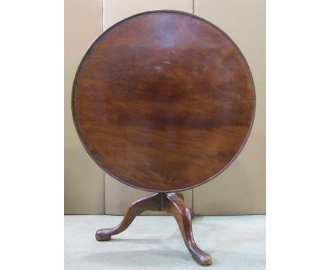 A 19th century mahogany tripod table with turned vase shaped pillar beneath a large circular tray top 92 cm (3ft in diameter)