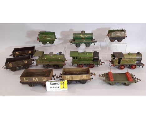 O gauge Hornby railway collection comprising clockwork locomotives, wagons and track; includes 3x 0-4-0 locomotives in green 