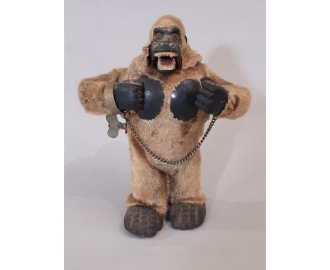 Marx Toys (Japan) 1960's mechanical gorilla with clockwork motor and fur covering; when wound the toy walks, thumps chest, an