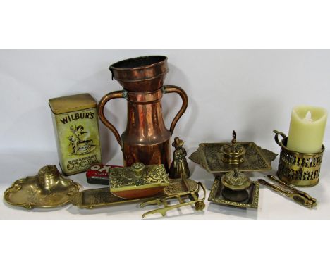A mixed selection of brass and copper ware including a copper funnel, copper two handled flagon, brass ink blotter, ink stand