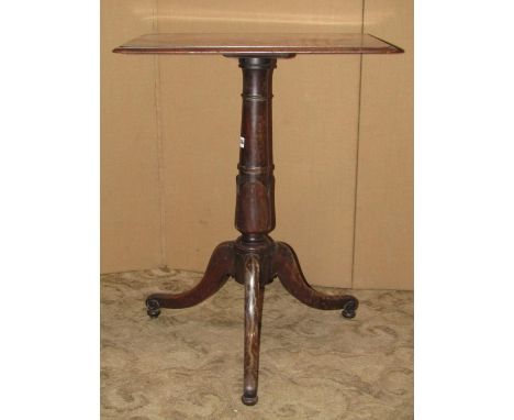 A 19th century mahogany occasional table, the rectangular top with moulded outline raised on a turned tulip pillar and swept 