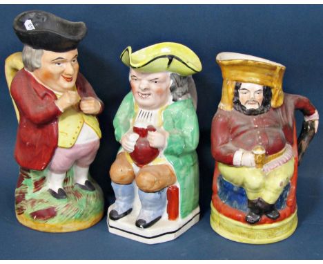 A 19th century Staffordshire jug showing Falstaff seated and holding a flagon, a further 19th century snuff taking toby and a