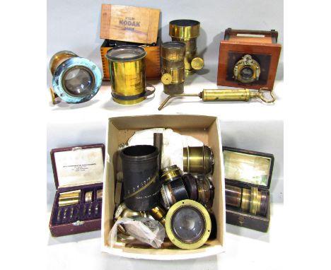 A collection of Victorian and other lenses, including the Stereoscopic portrait lens 6½ x 4¾, a Ross 18x16 lens, Horne Thornt