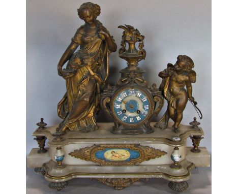 Mid-19th century onyx and gilt brass mantle clock, the eight day French striking movement within a stylised frame, flanked by
