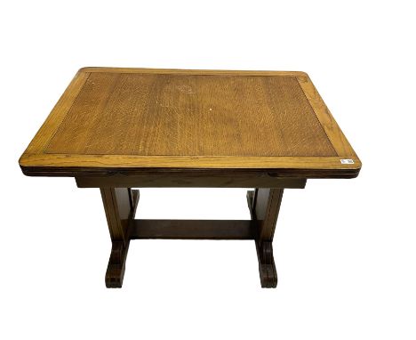 Oak rectangular extending dining table, shaped end supports with foliate decoration, on sledge feetDimensions: Height:&nbsp;7